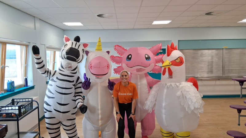Mascots and Shona Shields in a classroom