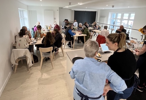 Group of people in café setting 