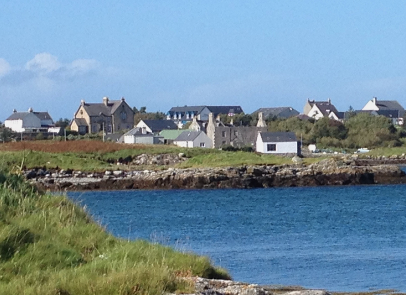 village with sea in foreground 